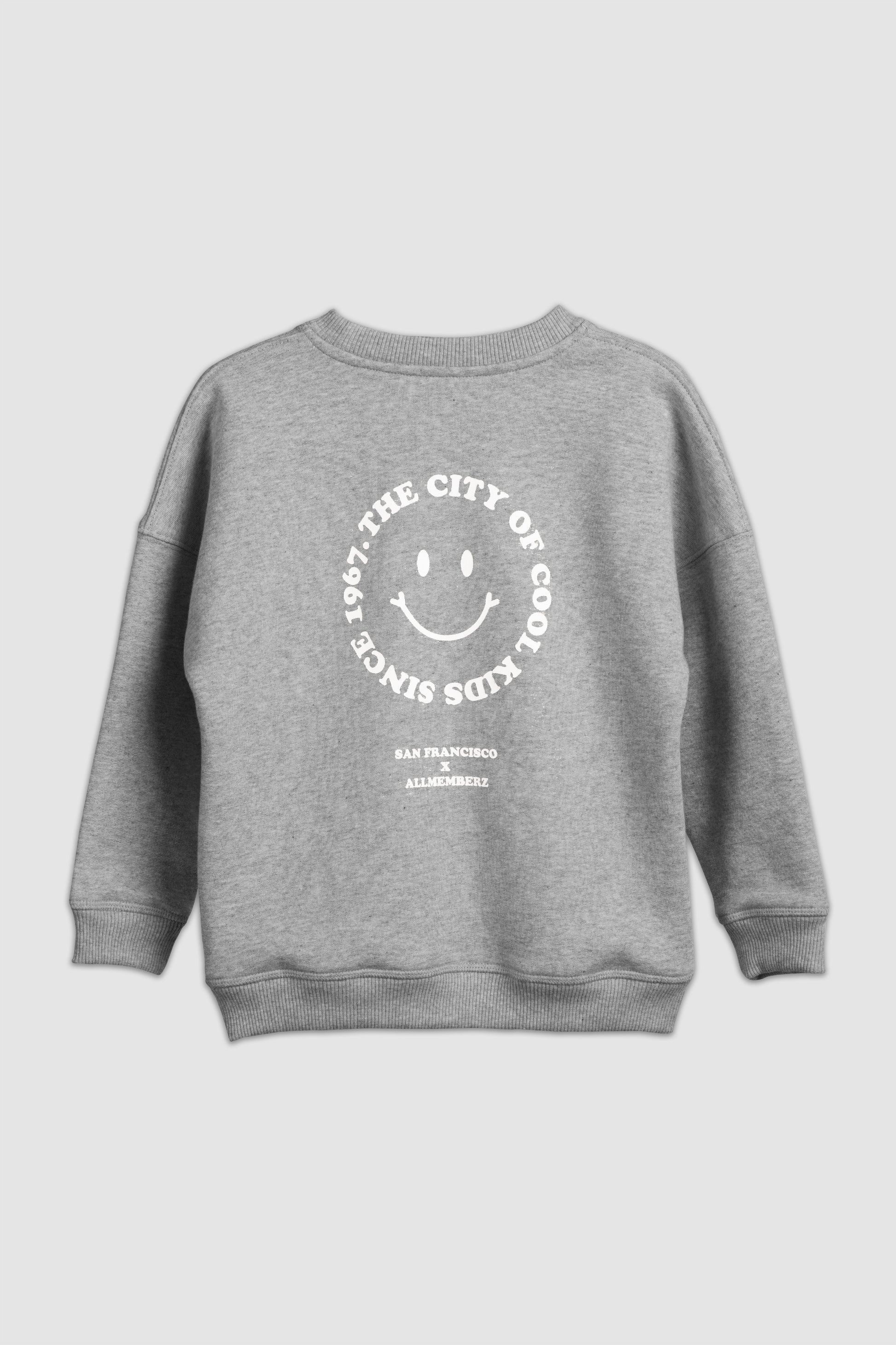 Sweat pour enfants look streetwear coupe oversize unisexe gris chiné en coton bio motif imprimé happy face San Francisco
